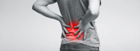 Millennial man touching his sore loin, suffering, back view, panorama